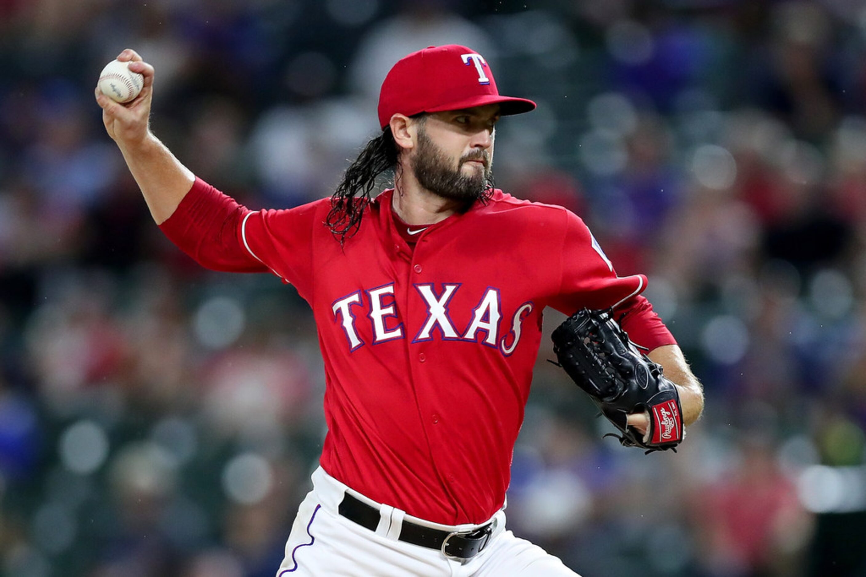 ARLINGTON, TX - AUGUST 13:  Cory Gearrin #44 of the Texas Rangers pitches against the...