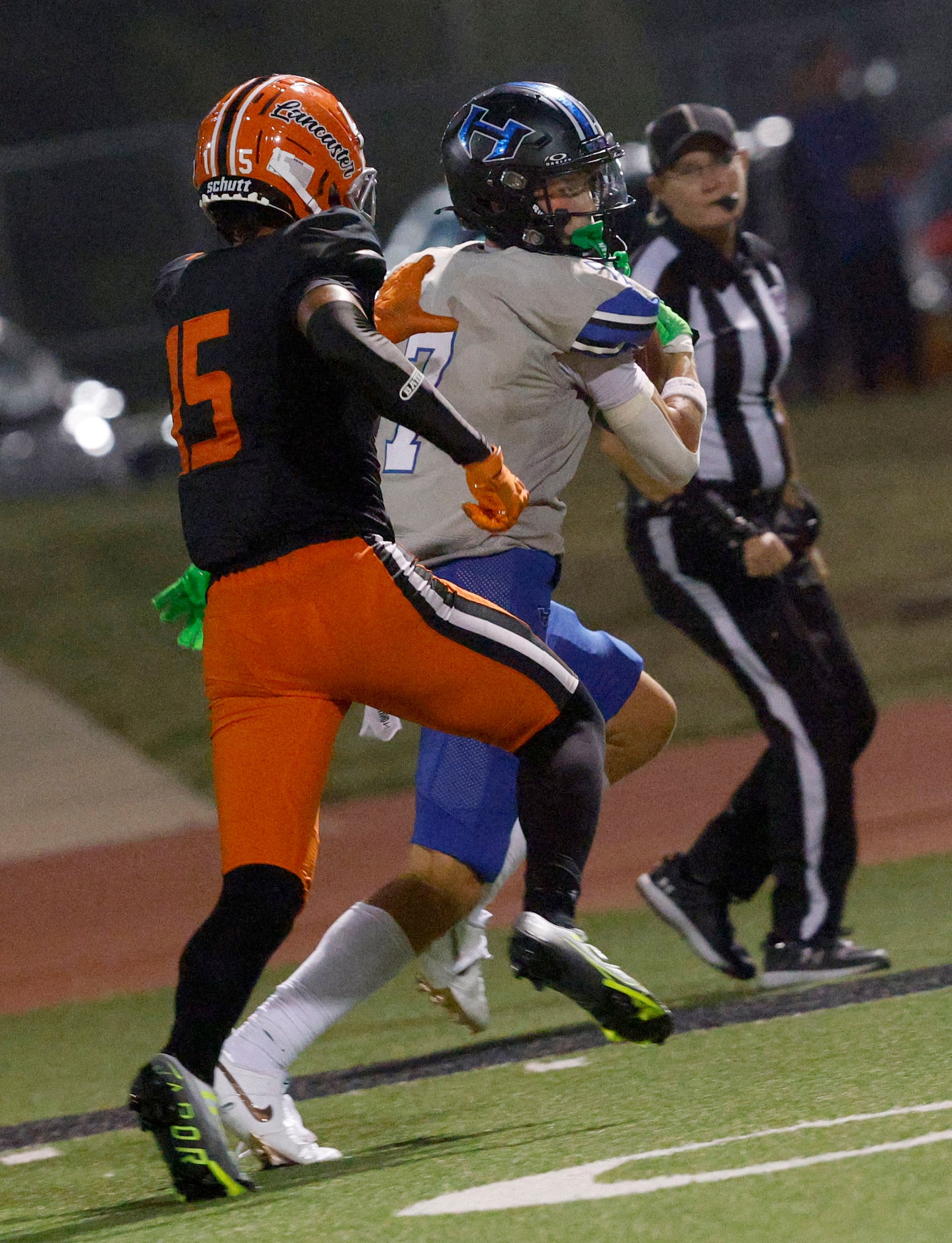 Hebron’s Tyler Hoke (7) runs into the end zone for a touchdown as Lancaster’s James Foster...