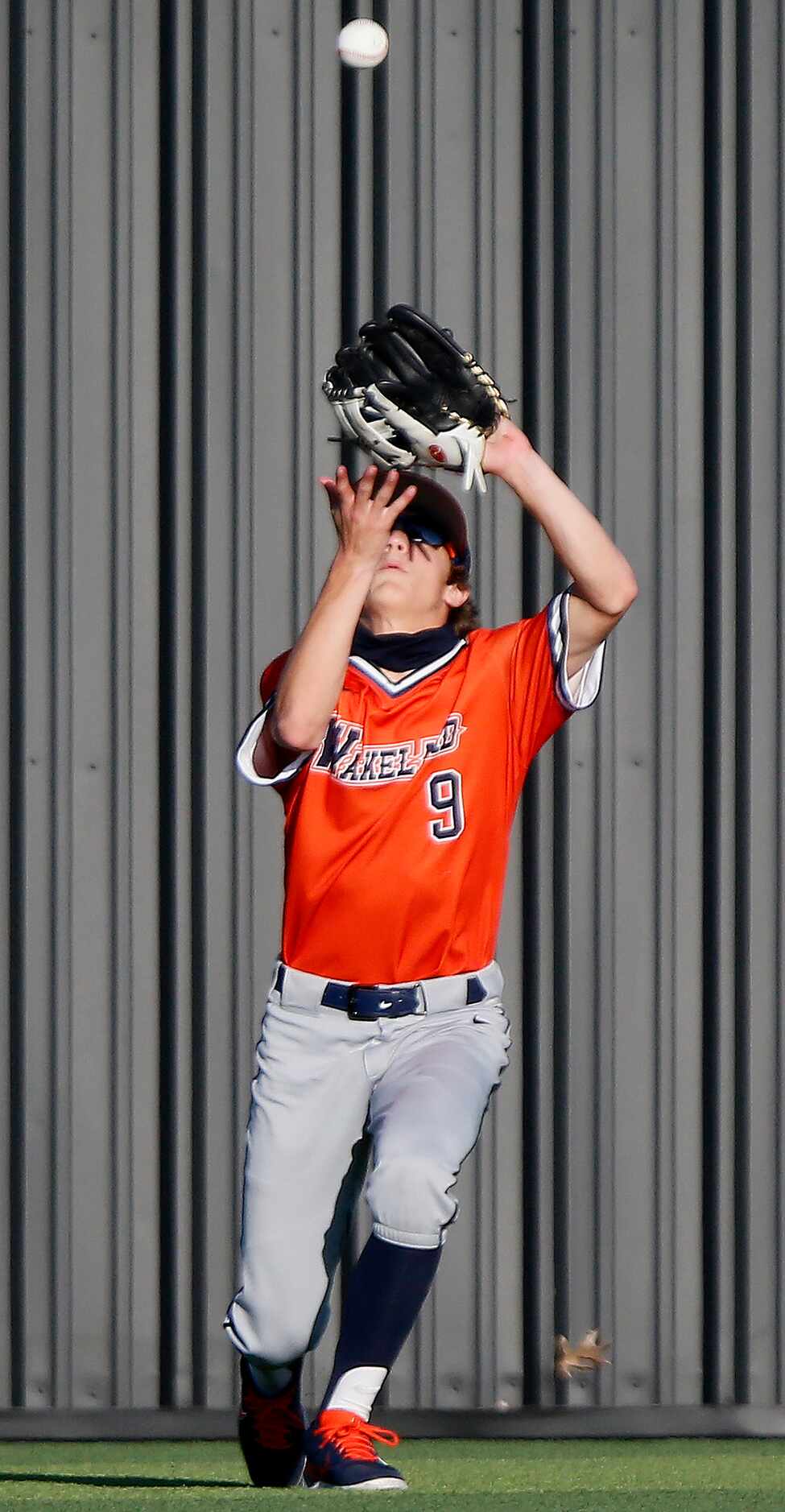 Wakelad centerfielder Dylan Snead (9) makes a catch for an out in the seventh inning as...