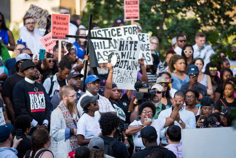 Plinks Green speaks while surrounded by protestors at a rally in downtown Dallas on...