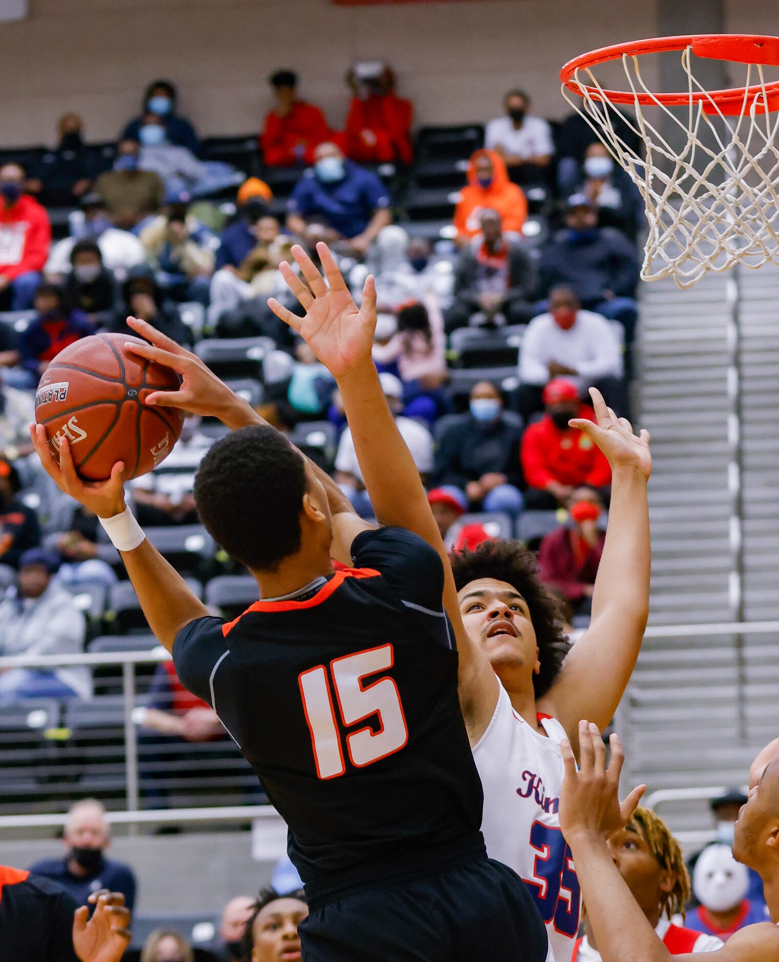 Lancaster's Kalen White (15) shot is blocked by Kimball's Aydan Blair (35) during the first...