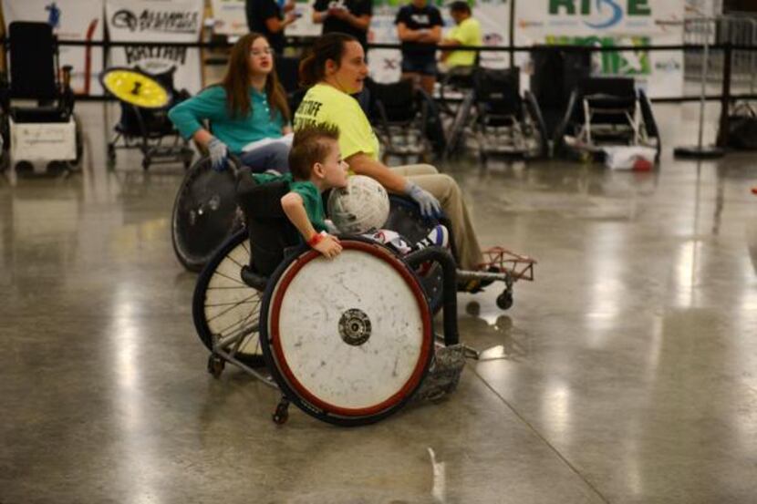 Bryce Winters, 8, plays quad rugby during the free skate at a two-day BMX and wheelchair...