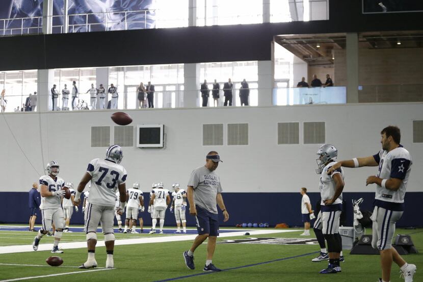 Dallas Cowboys quarterback Tony Romo throws the ball during practice inside the Ford Center,...