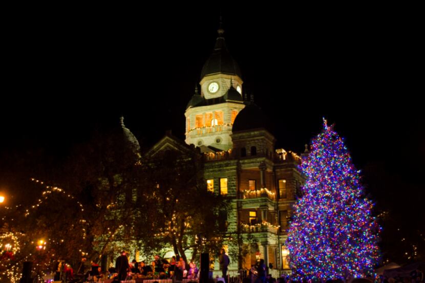 The Denton County Courthouse and the Christmas tree situated on the lawn light up the night...