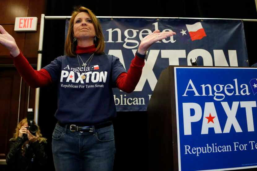 Angela Paxton acknowledges the applause of supporters at her election return party at the...