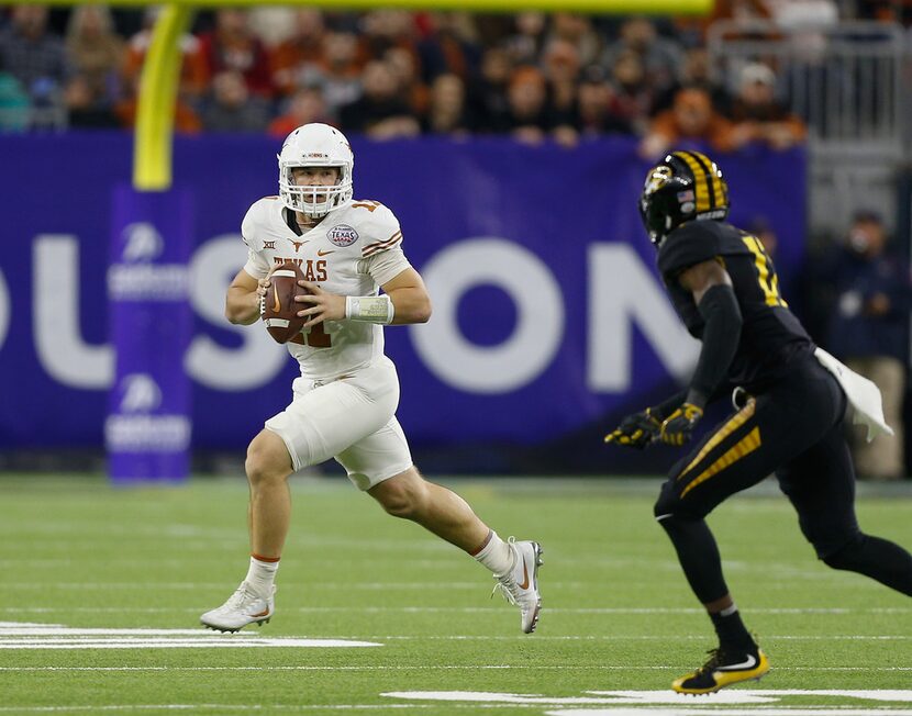 HOUSTON, TX - DECEMBER 27:  Sam Ehlinger #11 of the Texas Longhorns rolls out of the pocket...