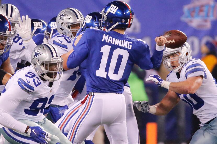 Dallas Cowboys outside linebacker Sean Lee (50) forces a fumble from New York Giants...