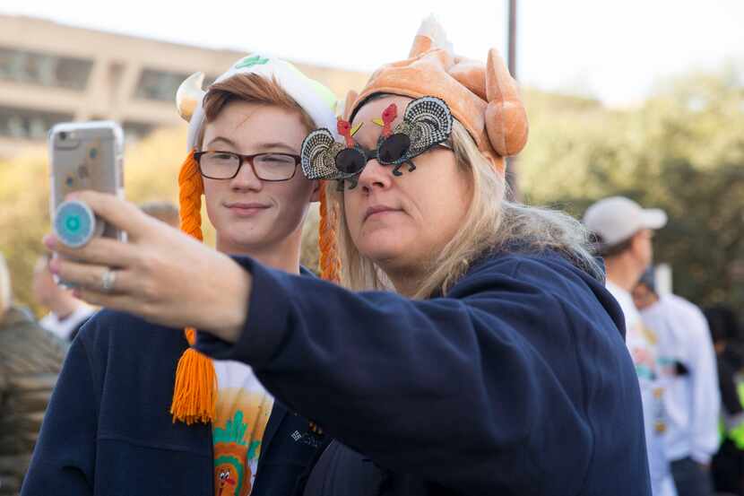 Stacie Collins (right) and nephew Colin Sumrall take a selfie before the Dallas YMCA Turkey...