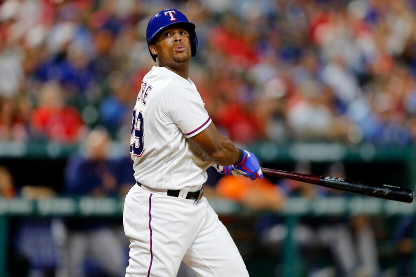 Texas Rangers third baseman Adrian Beltre (29) reacts after slicing off a foul ball in the...