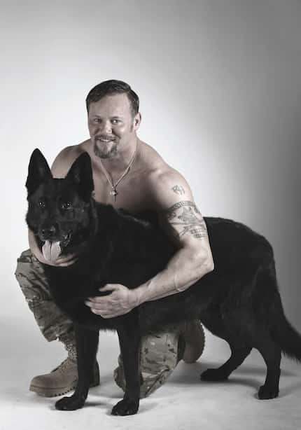 Ryan Henderson, 37, poses with his emotional support dog, Satan. Henderson and Satan served...