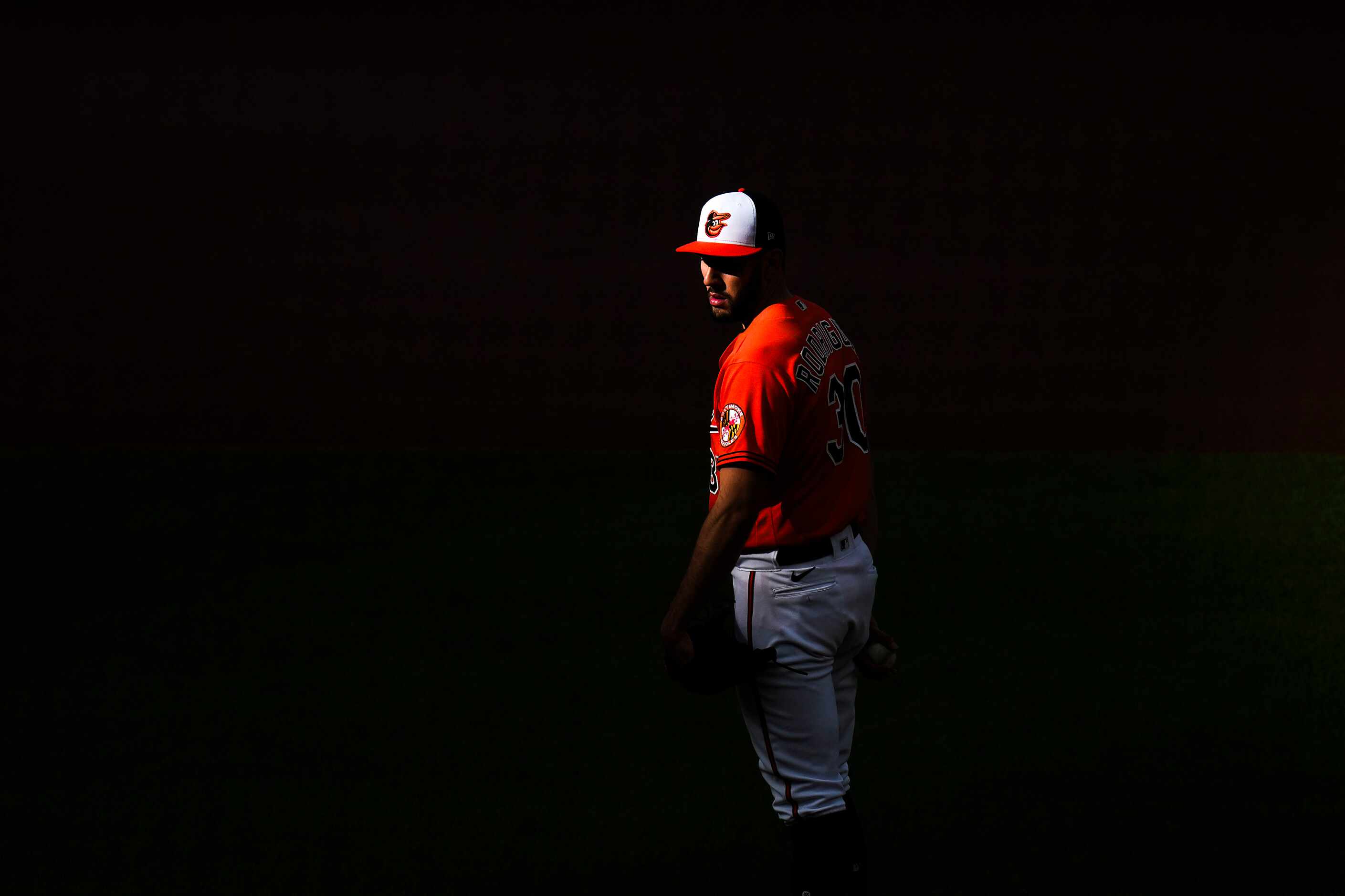 Baltimore Orioles starting pitcher Grayson Rodriguez looks in for a sign during the first...