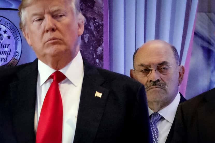 FILE - Allen Weisselberg, right, stands behind then President-elect Donald Trump during a...