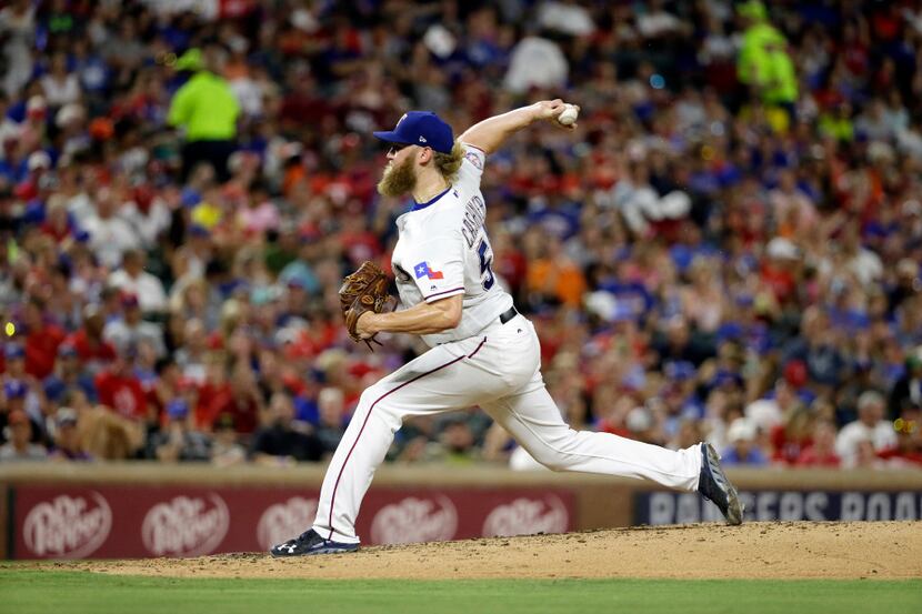 Texas Rangers' Andrew Cashner throws to the Baltimore Orioles in the sixth inning of a...