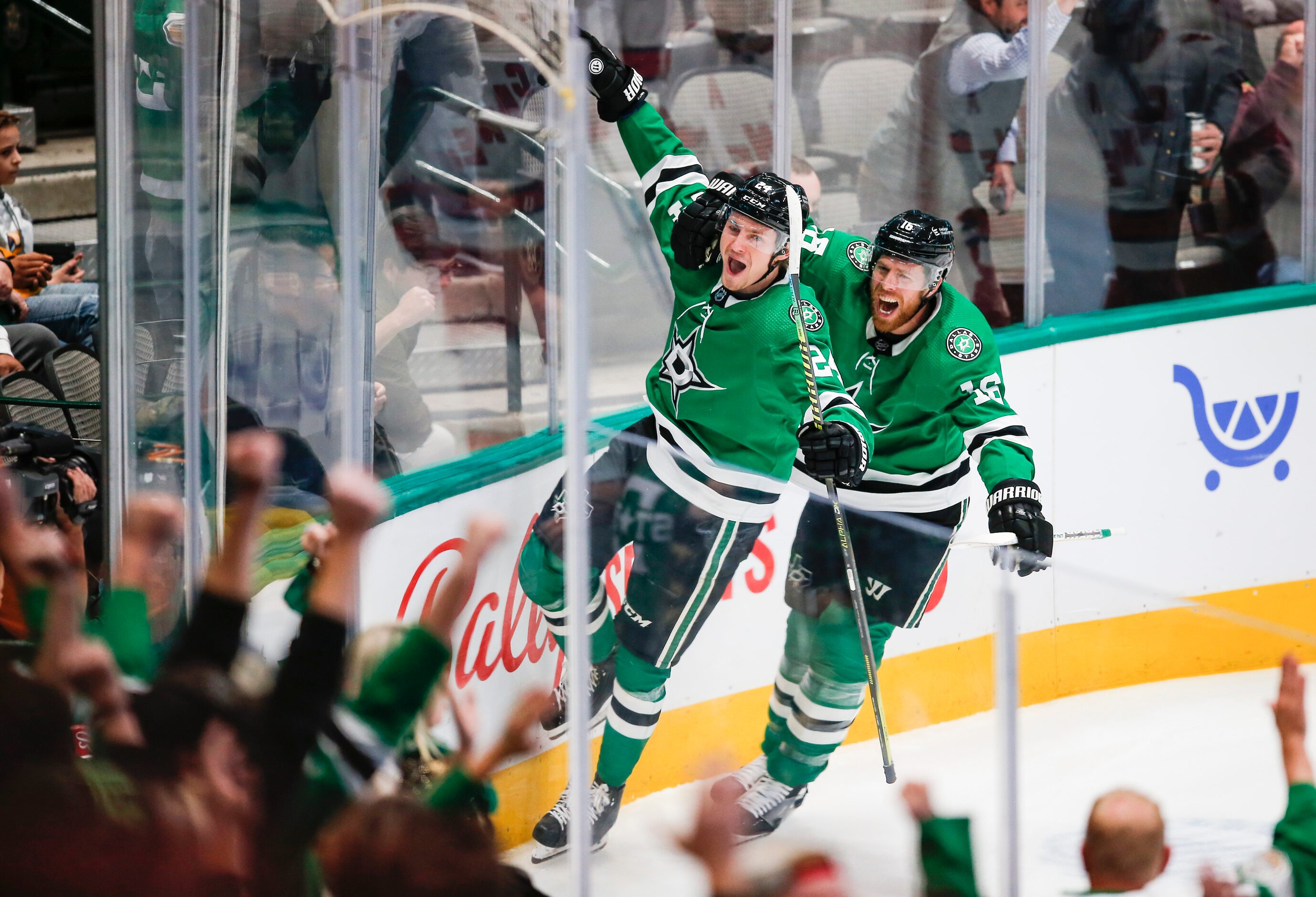 Dallas Stars forwards Joe Pavelski (16) celebrates with forward Roope Hintz (24) after Hintz...