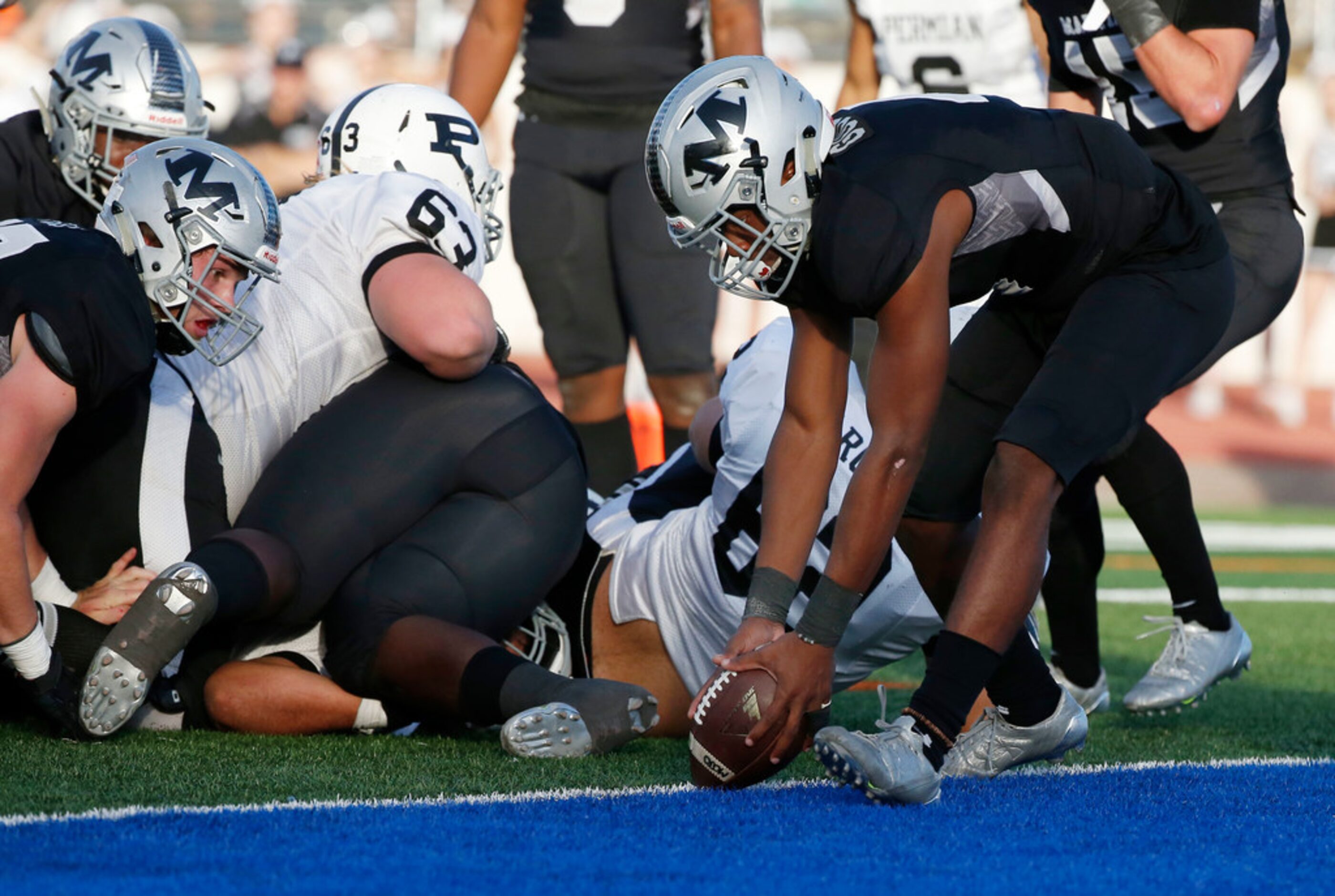 Arlington Martin defensive back Jayce Godley (4) picks up an Odessa Permian fumble at the...