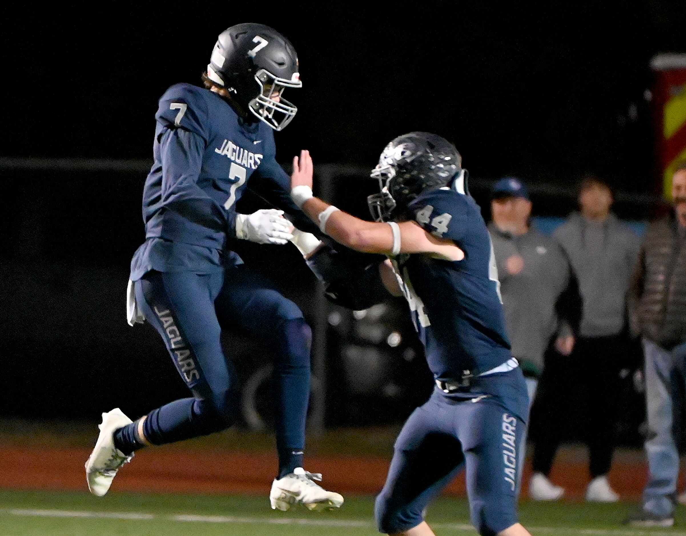 Flower Mound's Cade Harwell (7) and Flower Mound's Ryan Brubaker (44) celebrate after a...