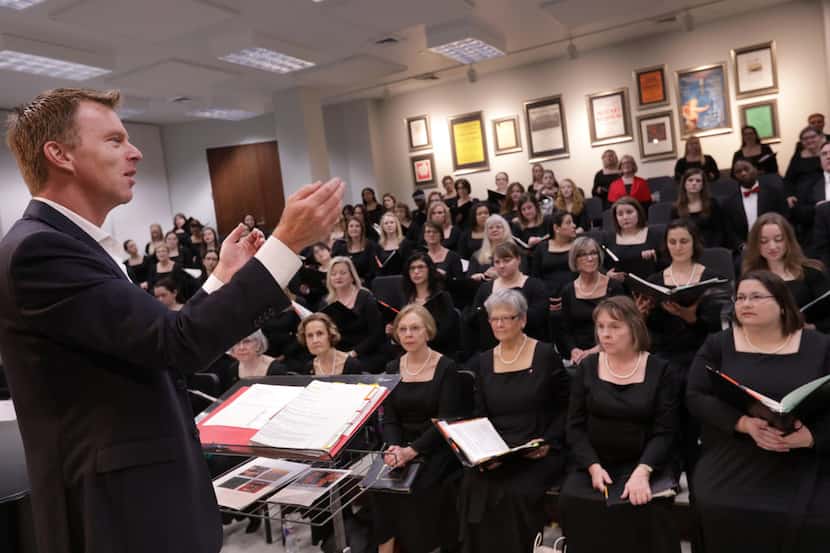 Director Joshua Habermann leads the Dallas Symphony Chorus during a warm up at the Meyerson...