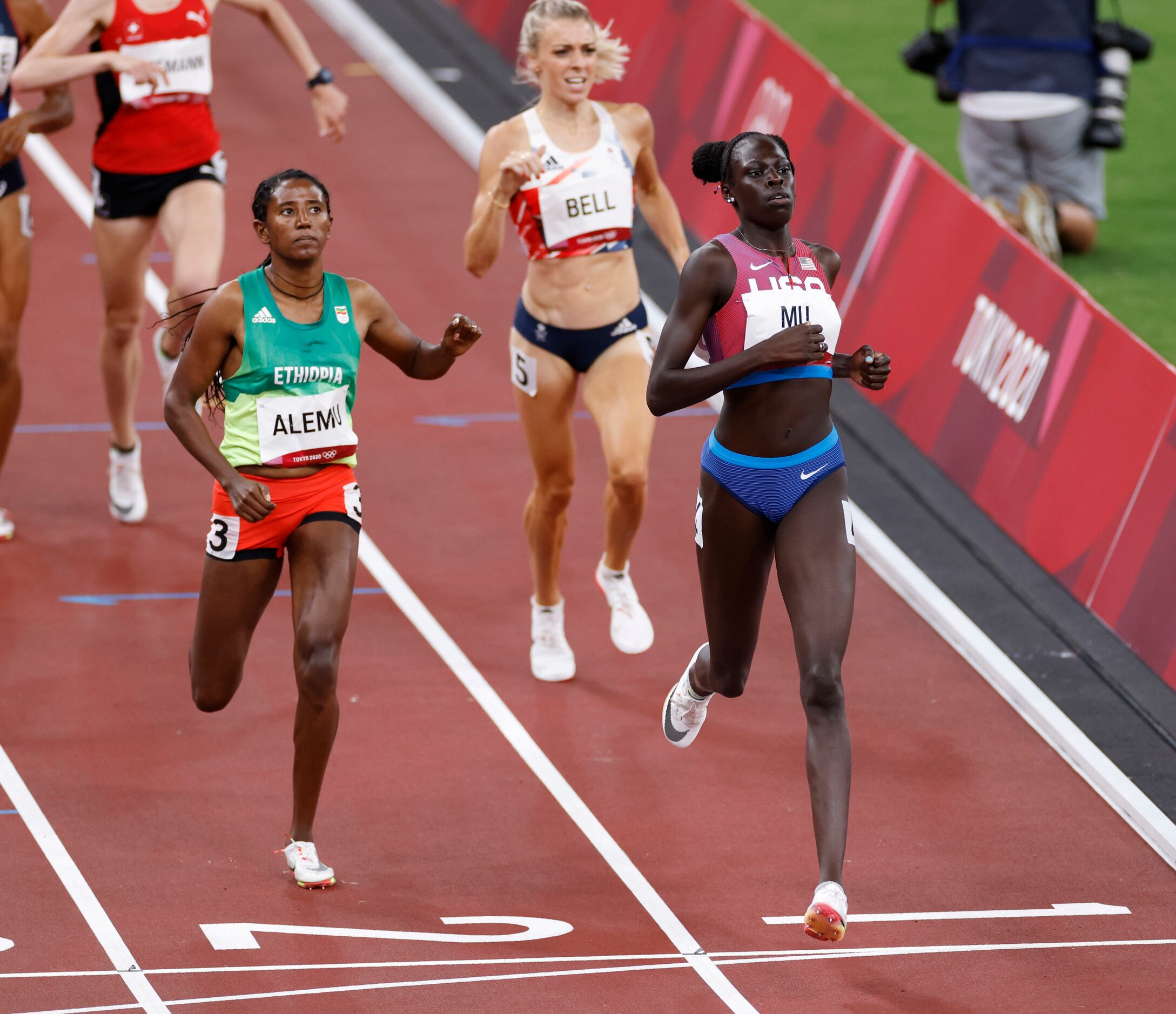 USA’s Athing Mu leads the way in front of Ethiopia’s Habitam Alemu as she competes in the...