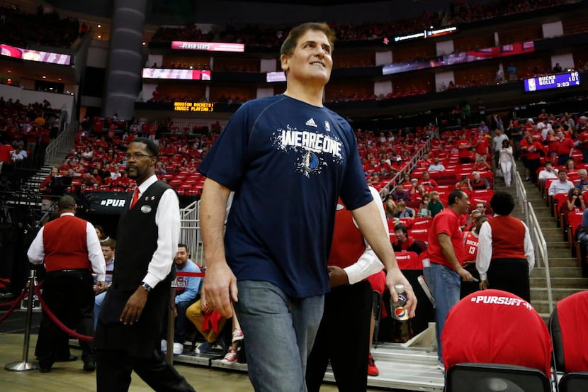 Dallas Mavericks owner Mark Cuban makes his way onto the court before a game against the...