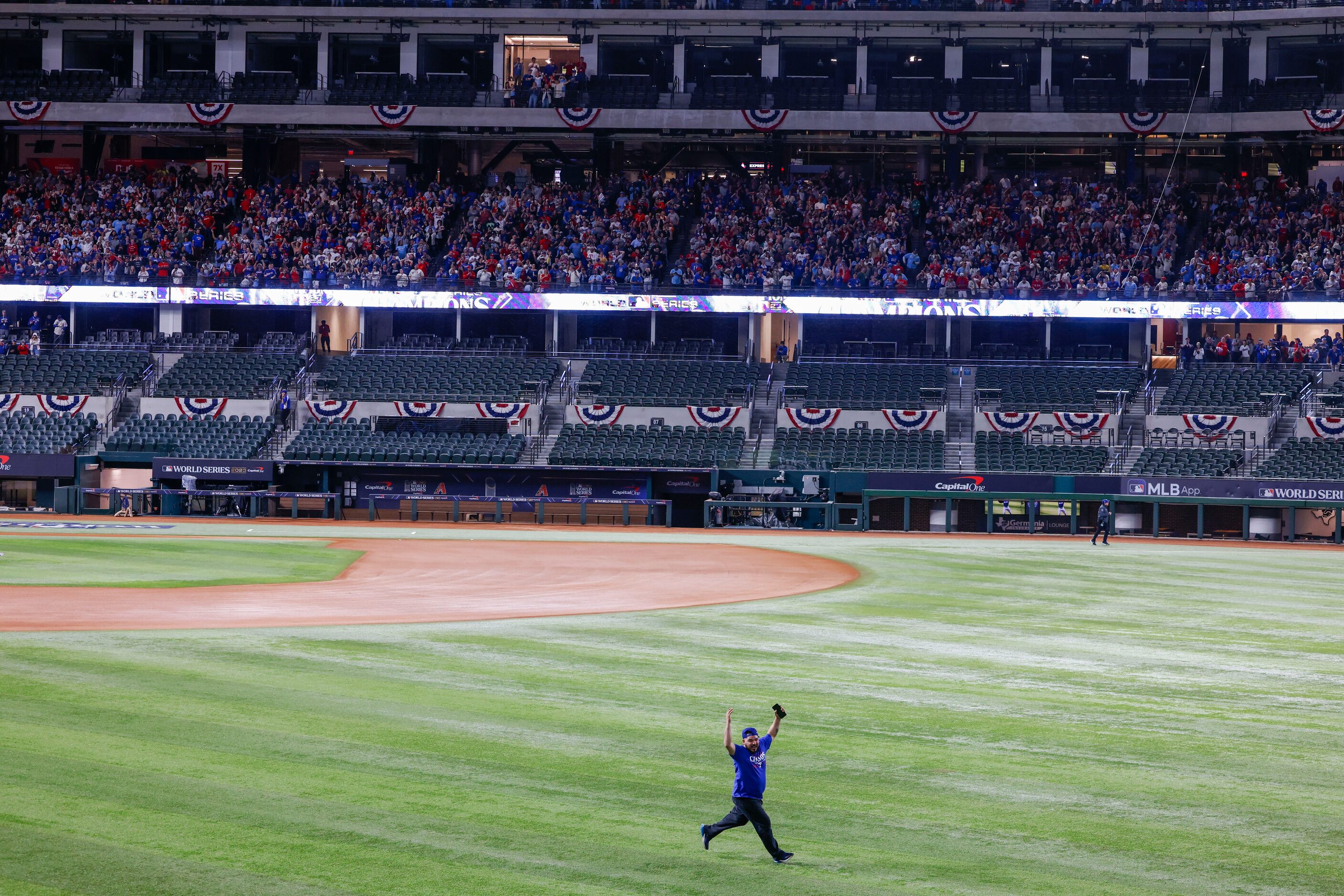 Some Texas Rangers fans ran onto the field following Texas Rangers’ winning the World Series...