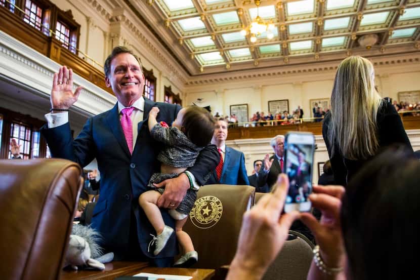 Texas State Rep. John Zerwas was sworn in while holding Tinley Zerwas, 1, during the first...