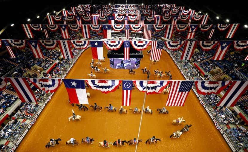 Fprt Worth Stock Show and Rodeo officials, dignitaries, and participants on horseback form a...