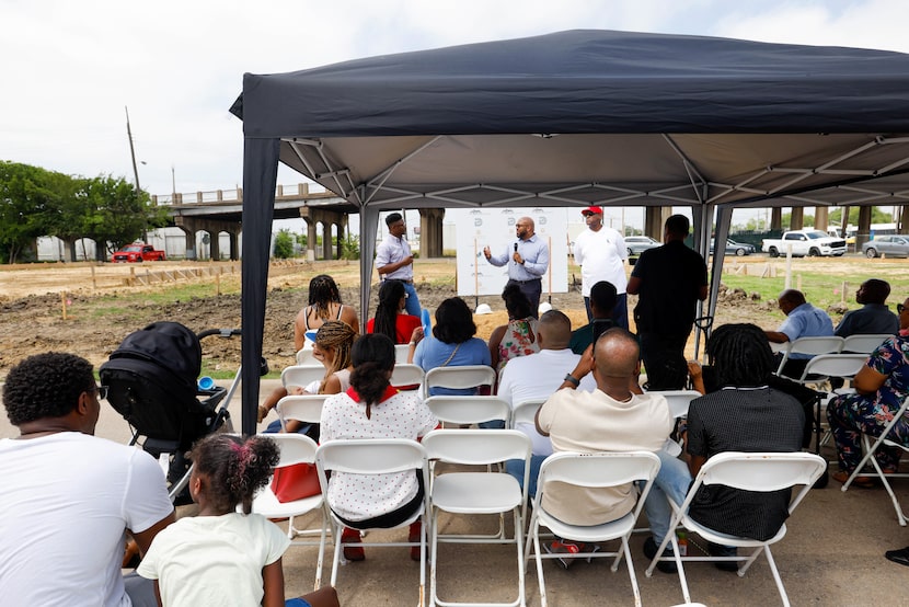 Developers Scottie Smith Ⅱ (left) and Kevin Hemphill (right) listen to Matt Houston (center)...