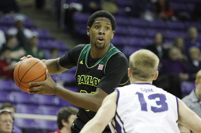 Baylor Bears forward Royce O'Neale (00) is defended by TCU Horned Frogs guard Christian Gore...