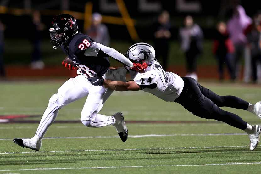 Coppell running back Xavier Mosely (28) tries to get past  Denton Guyer defensive back Caleb...