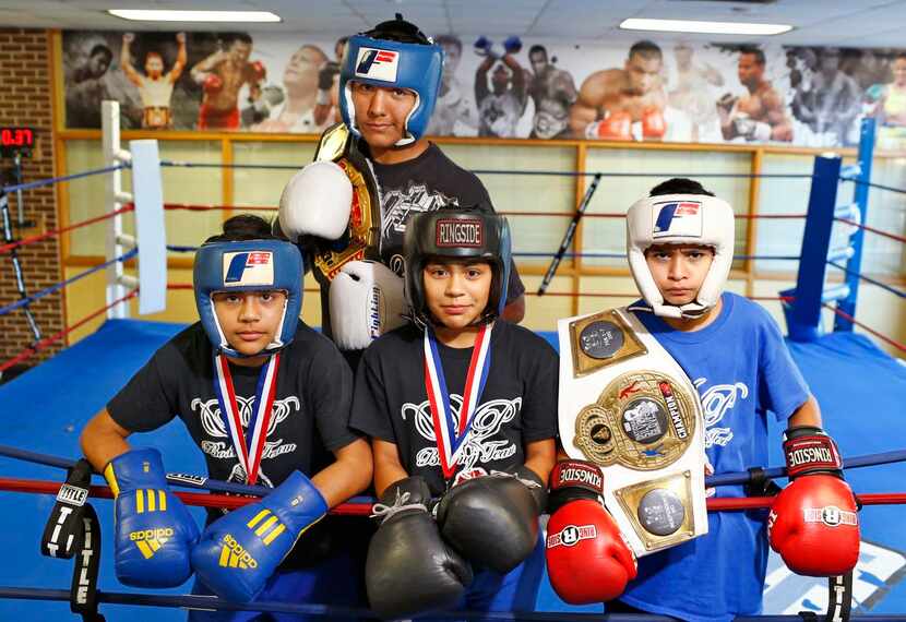 
Young boxers include (from left) Oliver Badillo, John Escobedo, Candice Badillo and Angel...