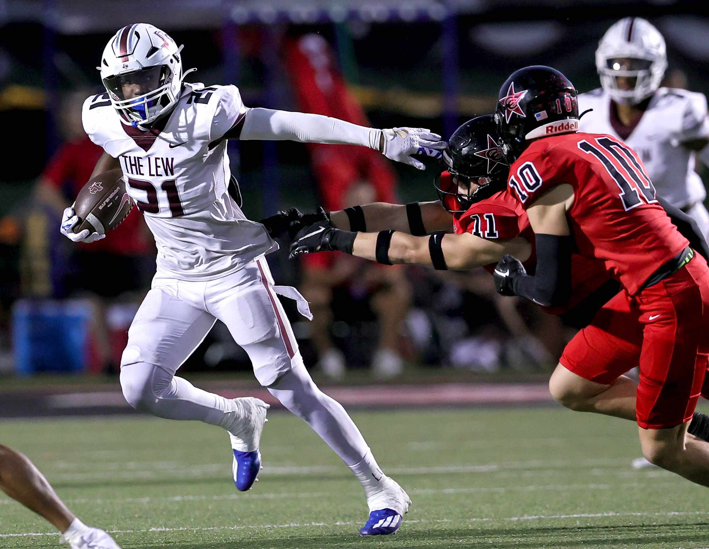 Lewisville running back Viron Ellison (21) tries to get to the corner against Coppell...