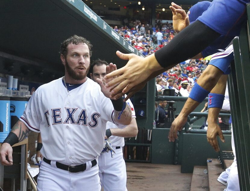 Texas Rangers left fielder Josh Hamilton (32) is pictured in the dugout during the Boston...