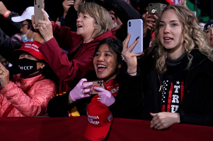 Supporters in Georgia cheer the president during his appearance in one of the election's...