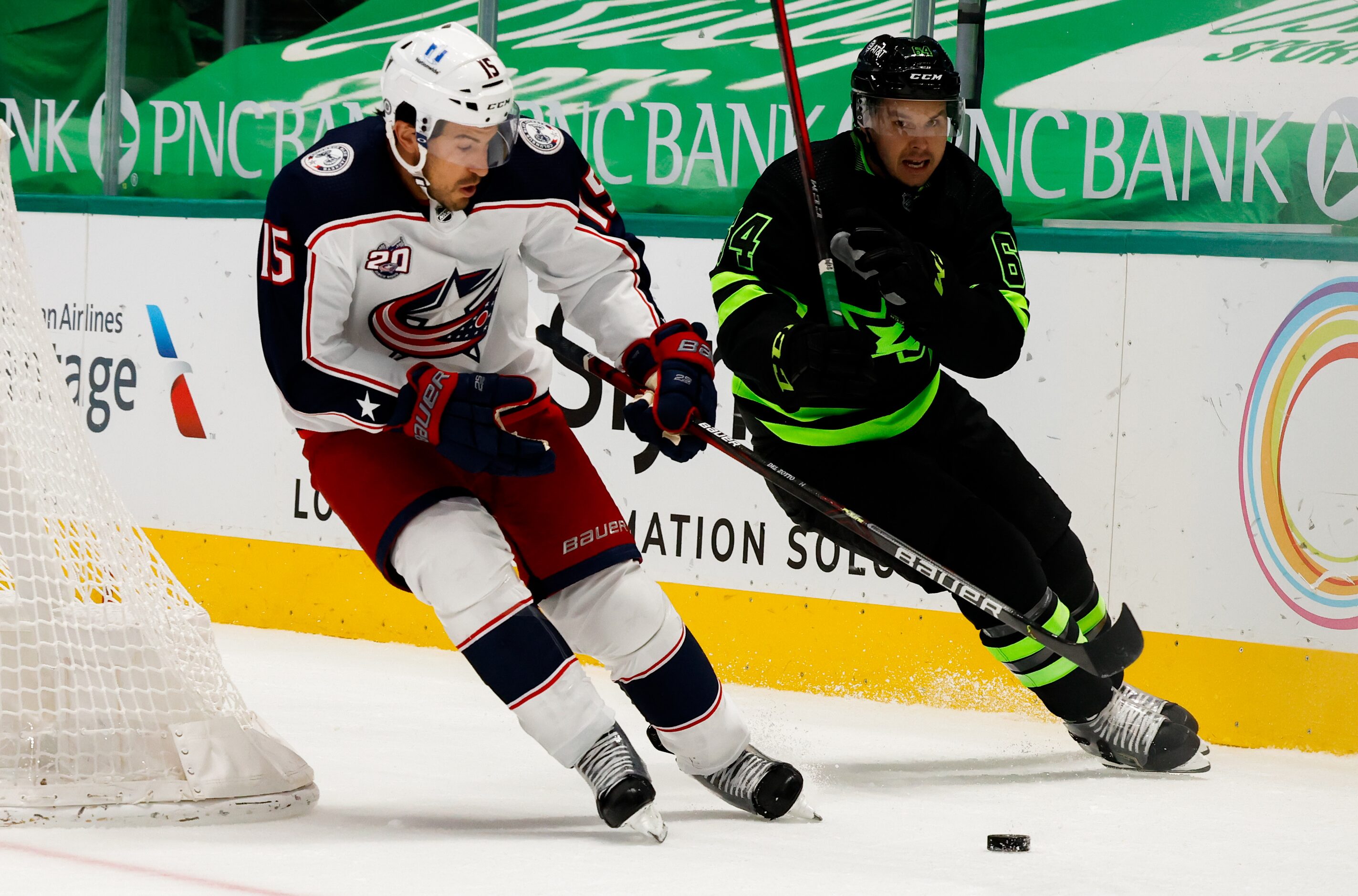 Dallas Stars center Tanner Kero (64) goes after Columbus Blue Jackets defenseman Michael Del...