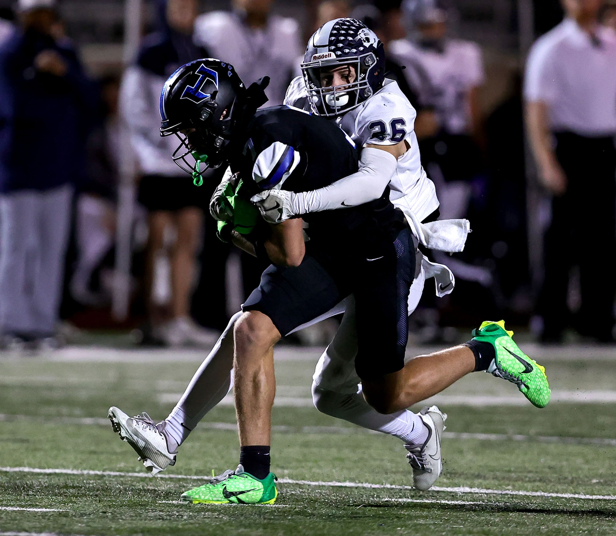 Hebron wide receiver Tyler Hoke (7) is stopped by Flower Mound cornerback Drew Gullickson...