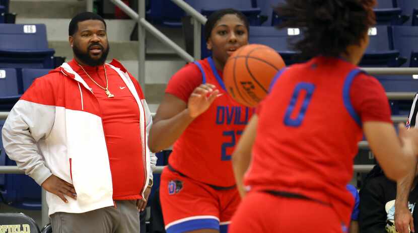 Duncanville coach Neiman Ford (left) watches his players during second-half action against...