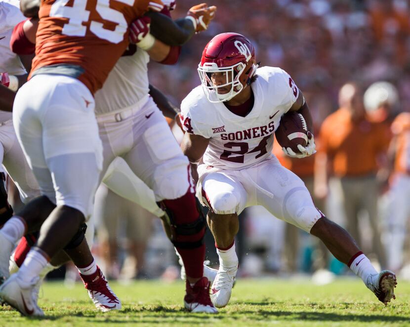 FILE - Oklahoma Sooners running back Rodney Anderson (24) runs the ball during the second...