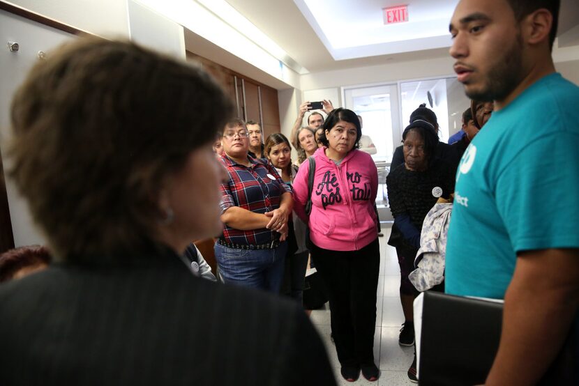 HMK tenants listened to assistant city attorney Melissa Miles and translator David...