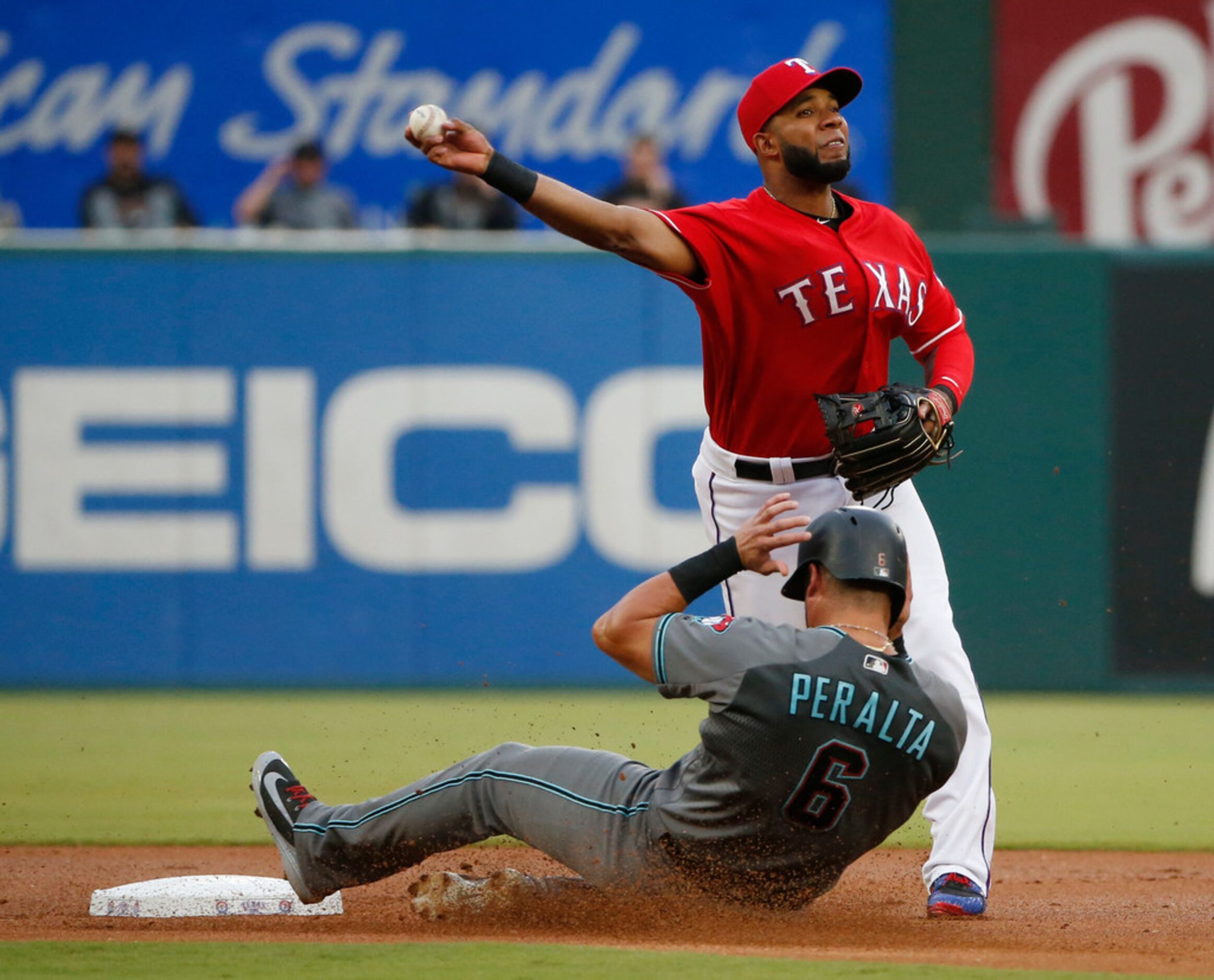 Arizona Diamondbacks' David Peralta (6) is forced out by Texas Rangers shortstop Elvis...