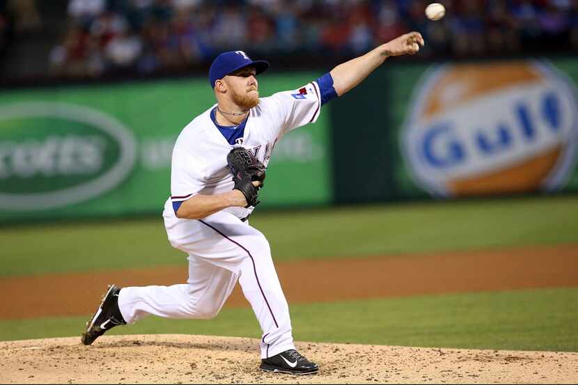 ARLINGTON, TX - APRIL 2:  Robbie Ross #46 of the Texas Rangers pitches in the first inning...
