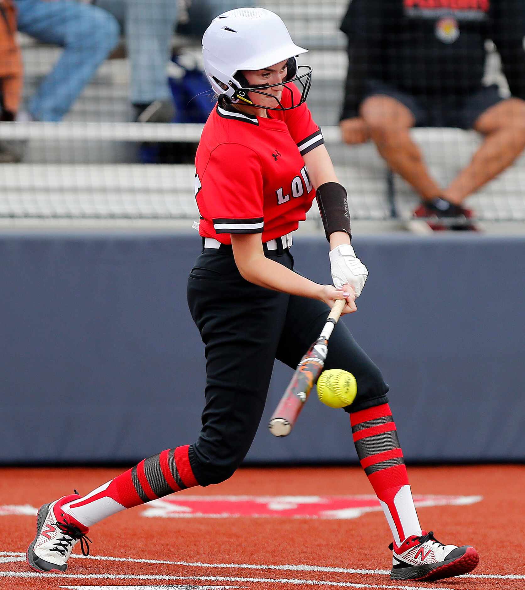 Lovejoy right fielder Bailey Bradshaw (18) gets a hit in the third inning as Lovejoy High...