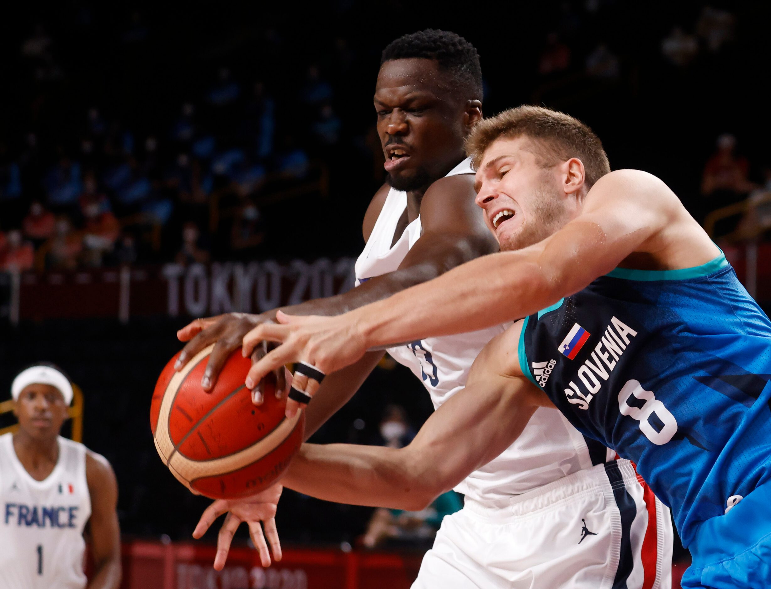 Slovenia’s Edo Muric (8) and France’s Moustapha Fall (93) go after a loose ball during the...