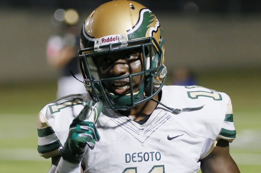 DeSoto Junior wide receiver KD Nixon  (11) celebrates scoring a touchdown during the first...