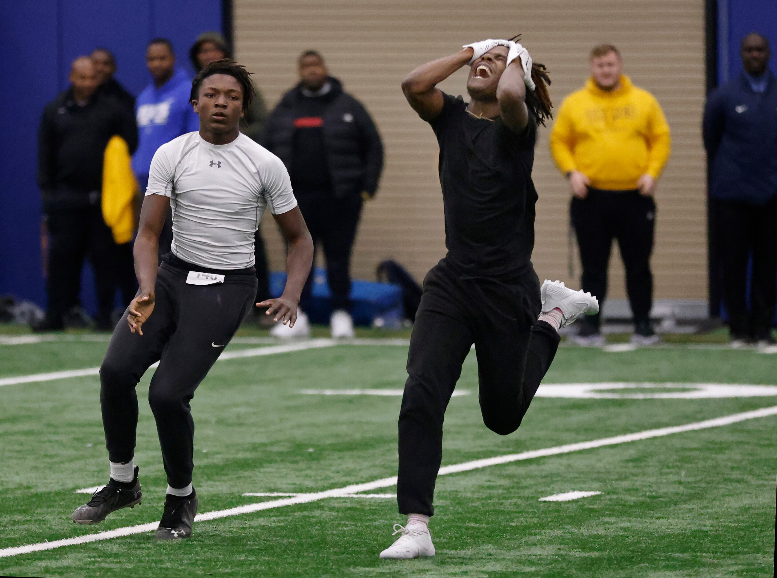 Unsigned senior Joshua Nealey of North Crowley High School (right) reacts after nearly...