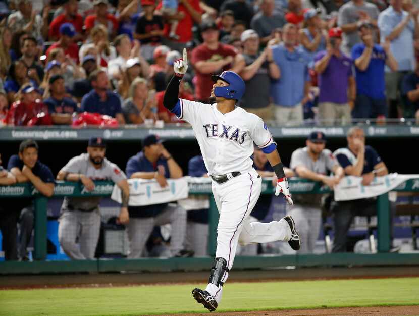 Texas Rangers center fielder Carlos Gomez (14) celebrates his solo home run against Boston...