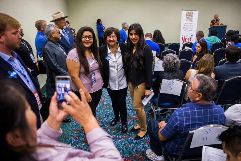 Gubernatorial candidate Lupe Valdez, center, poses for photos with delegates during the...