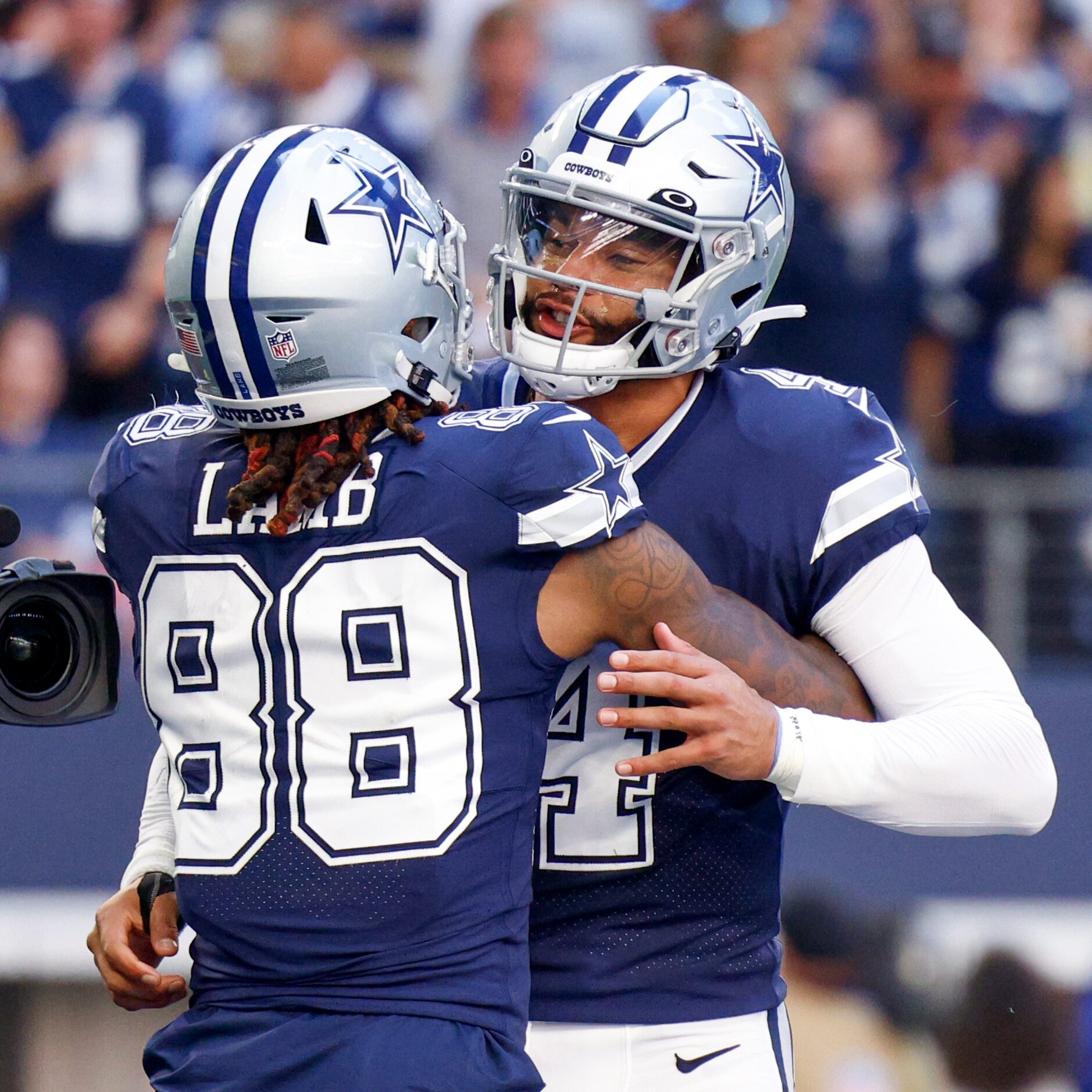 Dallas Cowboys wide receiver CeeDee Lamb (88) celebrates a touchdown catch with quarterback...