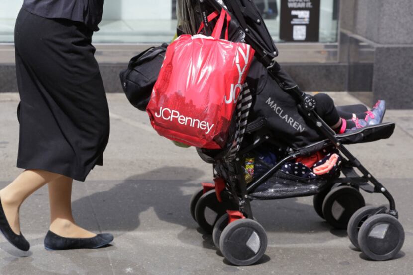 A shopper carries a J.C. Penney bag  in New York.