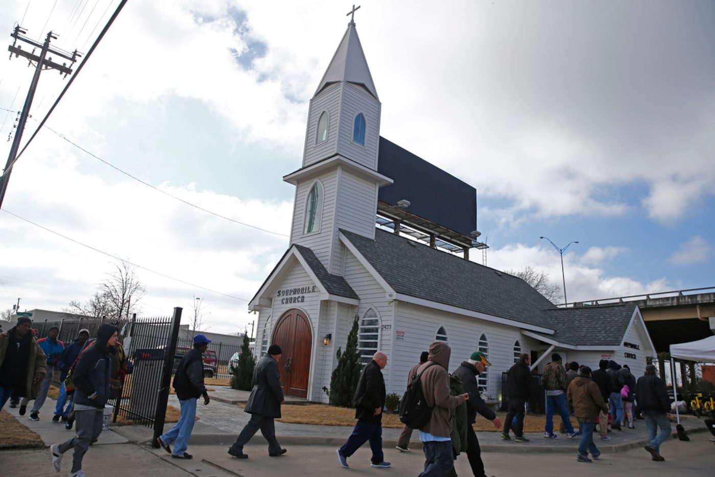 Homeless people filed into the SoupMobile Church for the homeless in Dallas on Feb. 4, 2018. 