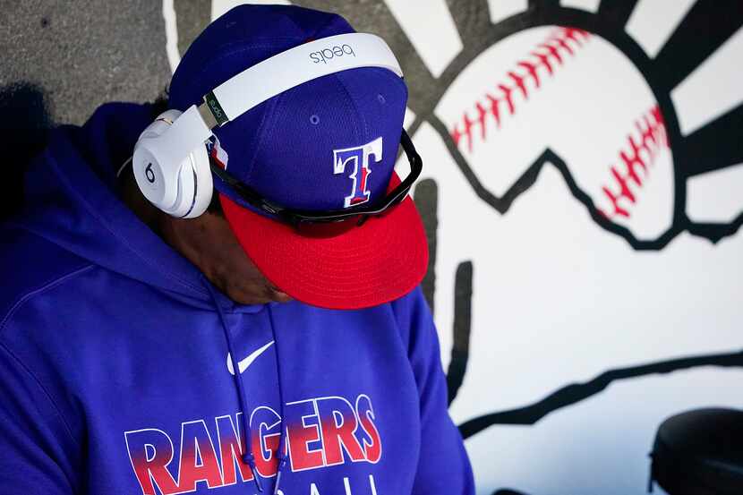 FILE - Rangers hitting coach Luis Ortiz is pictured in the dugout before a spring training...